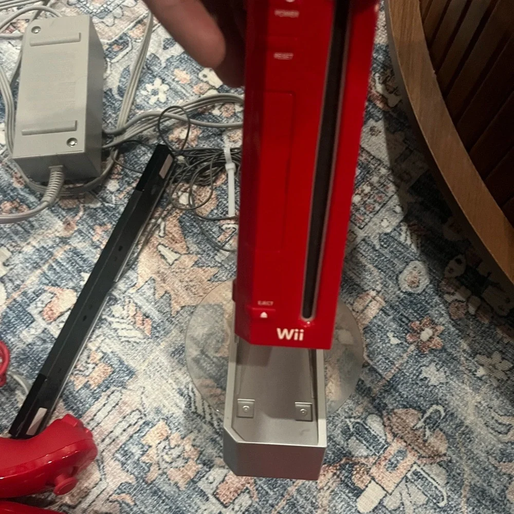 Nintendo Wii in Vibrant Red with Accessories controller. Some times. Works.